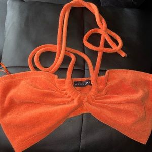 Orange crop top with tie around neck feature